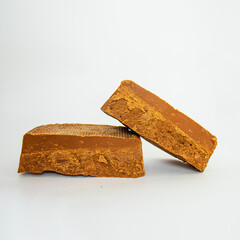 Norwegian brunost isolated on white background, Healthy food and eating, organic ingredient for breakfast, Traditional Scandinavian brown cheese, flat lay, mockup, template