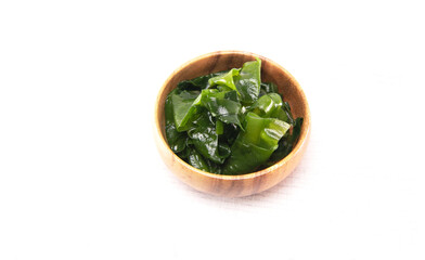 Laminaria (Kelp) seaweed wakame in wooden bowl. Japanese healthy food.
