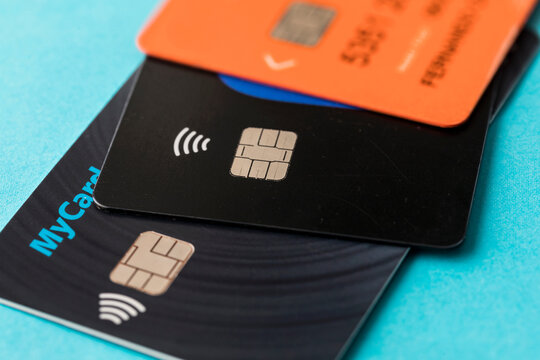 Credit card chip. credit cards with chip contactless payment technology. Selective focus with closeup of credit card chips on blue background for business and finance concept