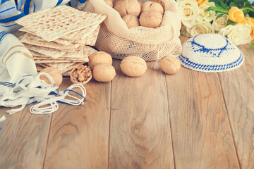 Passover celebration concept. Matzah, red kosher and walnut. Traditional ritual Jewish bread...