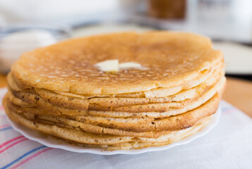 cooking traditional pancakes from wheat flour in the kitchen