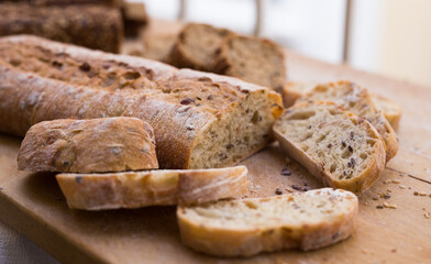 fresh loaf of bread on wooden board