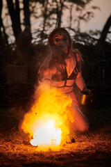 Girl fire dancing performance at outdoor art festival, smooth movements of female artist dancing...