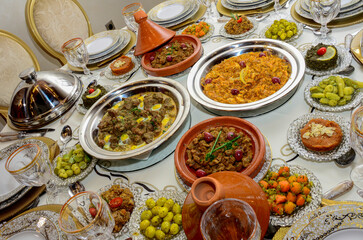 Fototapeta na wymiar Moroccan Algerian breakfast table. Vintage background with different plates with delicious traditional middle eastern food