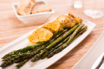 dietary meal rich in protein. Stir fried chicken breast and green asparagus
