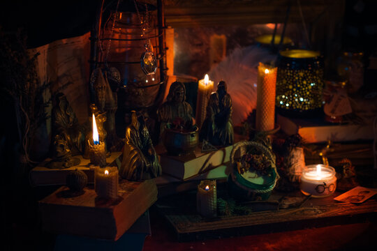 Illustration of magical stuff....candle light, magic wand, book of spells dark background, magic school, dark aesthetic, Halloween time