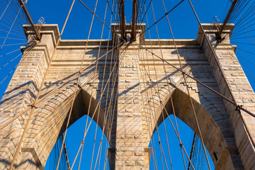 Details of one stone pier of the Brooklyn Bridge in NYC