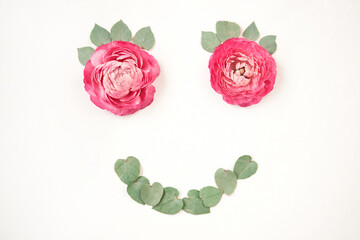 Fototapeta premium Smile with flowers. Valentine's day romantic background . Space for text. Love letter. Postcard mock up. Petals of flowers, roses and ranunculus. 