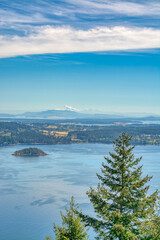 Gorgeous view of Mountain Baker over the ocean bay on blue sky background