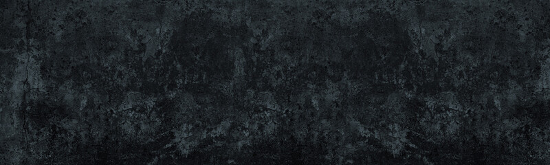Old cracked dark gray concrete wall wide texture. Gloomy grunge long panoramic black background