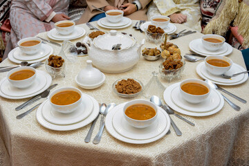 Moroccan Algerian breakfast table. Vintage background with different plates with delicious...