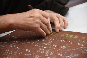 Katagami is traditional Japanese craft of making paper stencils for dyeing for example kimono textiles. Layers of thin washi paper are bonded with a glue extracted from persimmon. Beautiful artworks.