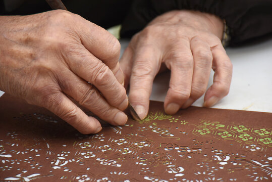 Katagami is traditional Japanese craft of making paper stencils for dyeing for example kimono textiles. Layers of thin washi paper are bonded with a glue extracted from persimmon. Beautiful artworks.