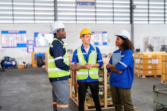 Warehouse Worker Standing Talking Discussion During Break Time In Goods Storage Area