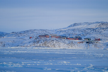 Colorful houses of Ilulissat on Greenland, Denmark, Scandinavia. The settlement is the third largest city on the island and is home to the largest Icefjord in the world.