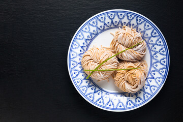 Asian food concept frech homemade organic Chinese Alkaline egg noodles on black background with copy space
