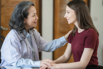 Fototapeta premium doctor she is encouragement while recommending medications at the clinic.