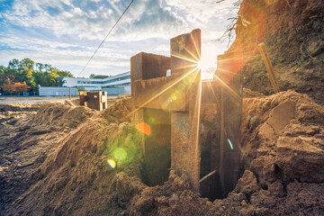 New construction site with steel mud soil and sunrise background