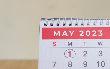 Closeup shot of a 2023 calendar, "April page". Selective focus shot of a calendar, focused on "May, 2023".
