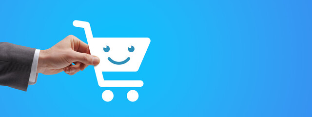 Customer holding a smiling shopping cart icon