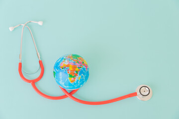 Earth with doctor physician's stethoscope, World heart health day, doctor day.