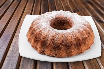 Tasty fresh baked cake on the desk