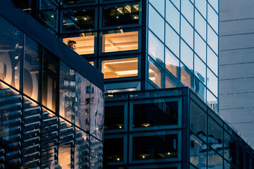 modern building at night in new york condominium apartment windows live house office rental leasing...