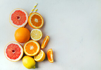 top view of orange grapefour and lemon citrus fruits with  herbs on white background