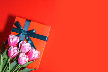 Valentine's day or mother's day background with gift box and tulips bouquet. Top view with copy space. High quality photo