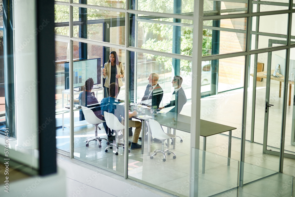 Poster taking stock and setting new targets. shot of a corporate businessperson giving a presentation in th