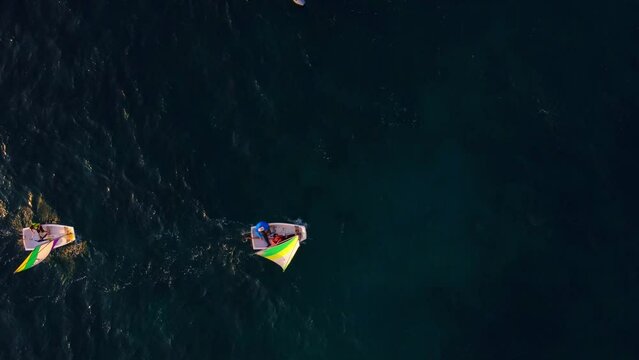 training of children on sailing boats optimist in Mediterranean sea