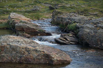 Naklejka na ściany i meble Stream among rocks in Swedish mountains
