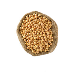 Raw organic soybeans in sack isolated on white background top view.