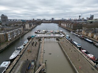 Boats moored  Greenland Dock Surrey quays London UK drone aerial view