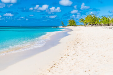 A view along an idyllic shoreline on the island of Grand Turk on a bright sunny morning