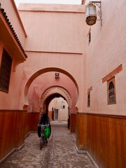 Arches in front of the 14th century Ben Youssef Madrasa, islamic college, in the Medina of Marrakech, Morocco.