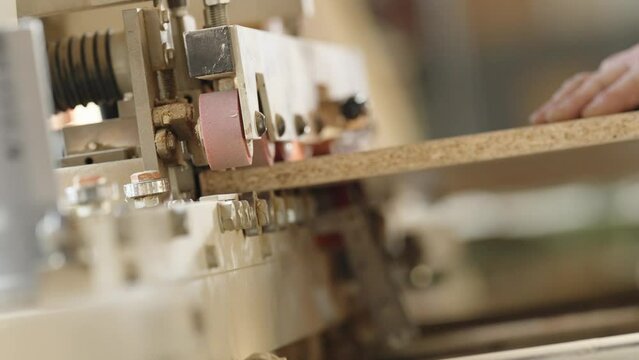 machine treatment of the edge of the laminate board in carpentry