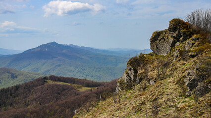 spring panorama of colorful mountains; vegetation coming back to life; european mountains covered with colorful plants
