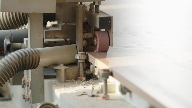 gluing the edge on a machine to a laminate board for the production of furniture in carpentry