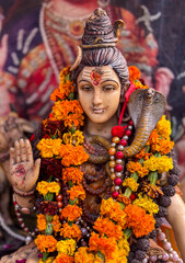 shiva god image with mala and snake in temple