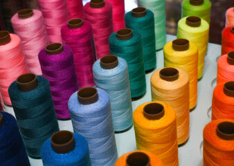 Rows of Multi-colored Thread Spools