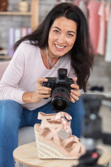 beautiful female photographer shooting shoes