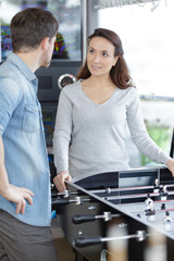 couple buying foosball at specialized store