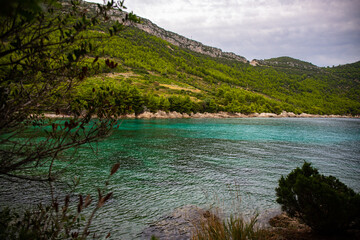 panorama of the peljesac peninsula coastline in croatia; an amazing Mediterranean coastline with rocks and green hills over turquoise water