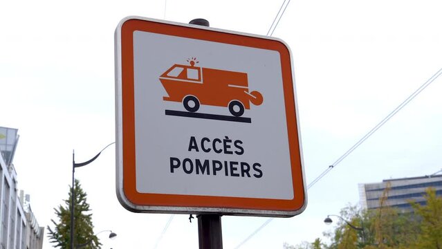 "Fire department access" french street sign at the entrance of a fire station