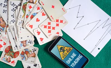 Foto op Plexiglas anti-reflex business concept, risks of trading online, deck of cards, stock echange chart and smartphone © Kirsten Hinte
