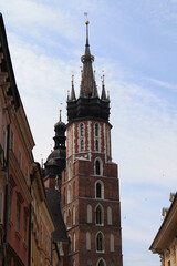 Fototapeta premium Cracow, Poland. Streets and old tenement houses around the old market. Mary's Basilica tower.