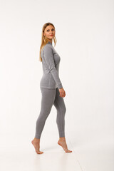 Fototapeta premium Sporty blonde girl in thermal clothing for women
