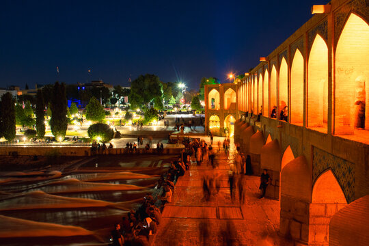 Isfahan, Iran - 15th june, 2022: Old Khajoo bridge at night, across the Zayandeh River in Isfahan, Iran.