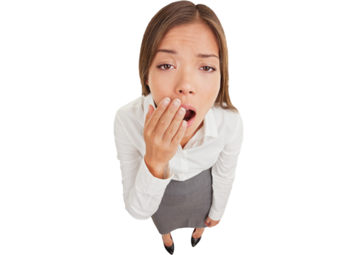 Exhausted or bored woman in yawn. Humorous high angle view of an exhausted or bored young woman yawning with her hand to her mouth and apathetic eyes, isolated on white background.
